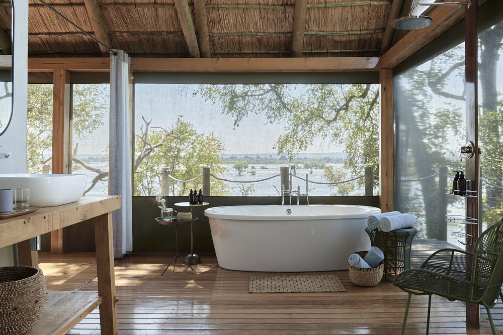 Bath with a view of the Zambezi Victoria Falls River Lodge / Courtesy of Zambezi Crescent Collection luxury African safari Zimbabwe