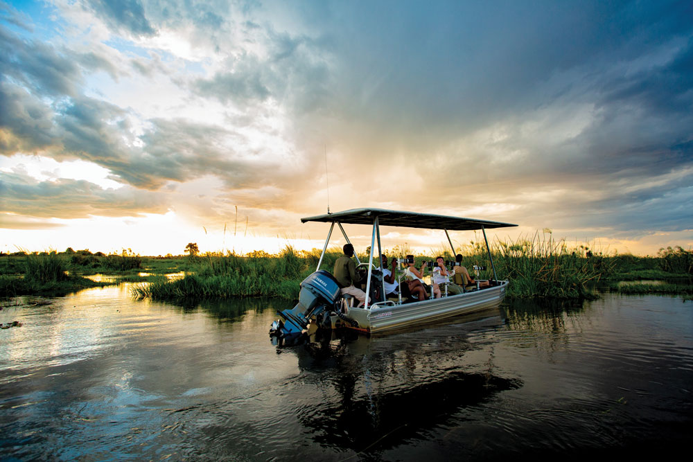 Boat Safari at Duba Plains Camp Botswana Okavango Luxury Safari / Courtesy Great Plains