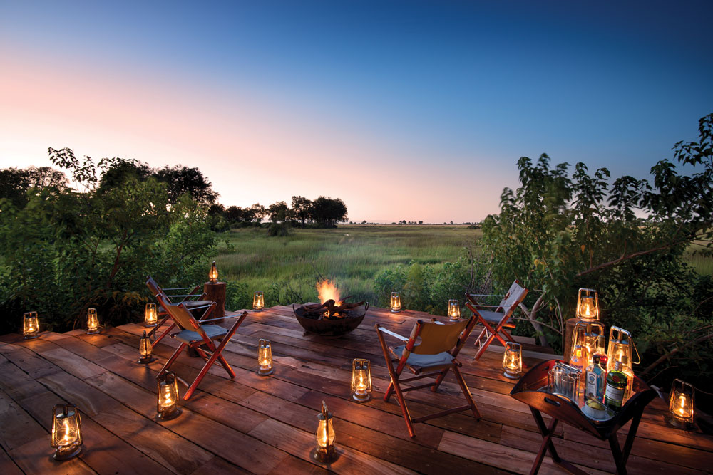 Sundowners at Duba Plains Camp Botswana Okavango Luxury Safari / Courtesy Great Plains