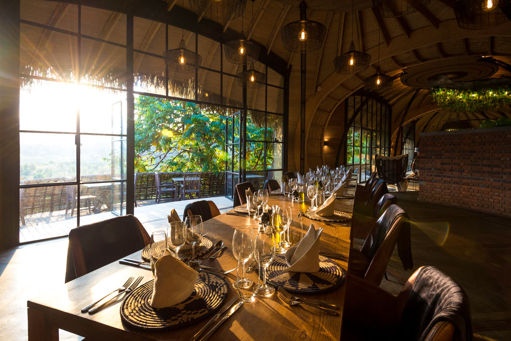 Dining at Bisate Lodge, Rwanda luxury gorilla trekking safari / Caroline Culbert / Courtesy of Wilderness Safaris