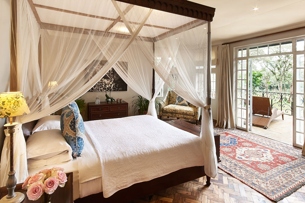 Karen Blixon Suite bed at Giraffe Manor, luxury Kenya safari / Courtesy of The Safari Collection