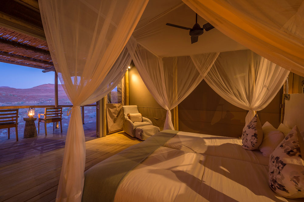 Bedroom at Damaraland Camp, Namibia luxury safari / Dana Allen / Courtesy Wilderness Safaris
