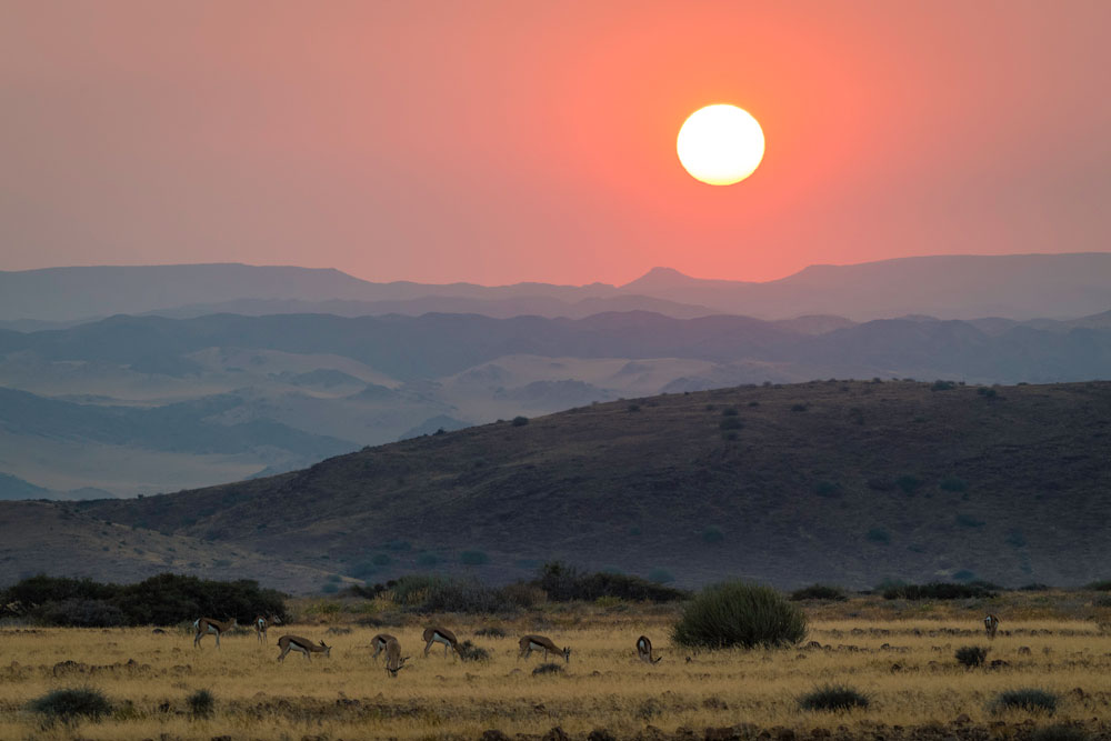Sunset at Damaraland Camp, Namibia luxury safari / Dana Allen / Courtesy Wilderness Safaris