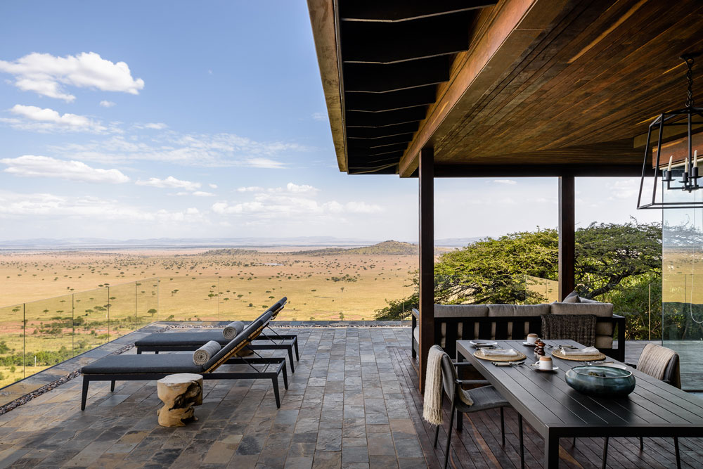 Balcony view at Singita Sasakwa Lodge, luxury Tanzania safari / Courtesy Singita