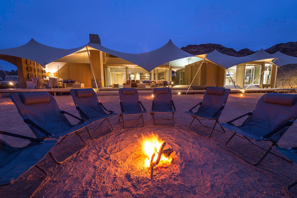 Campfire at Hoanib Skeleton Coast Camp, luxury Namibia safari / Dana Allen / Courtesy of Wilderness Safaris