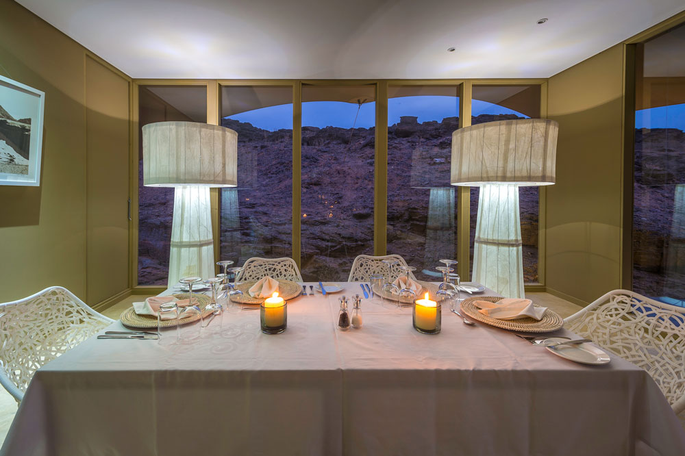 Dining at Hoanib Skeleton Coast Camp, luxury Namibia safari / Dana Allen / Courtesy of Wilderness Safaris