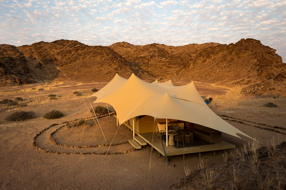 Guest tent at Hoanib Skeleton Coast Camp, luxury Namibia safari / Dana Allen / Courtesy of Wilderness Safaris
