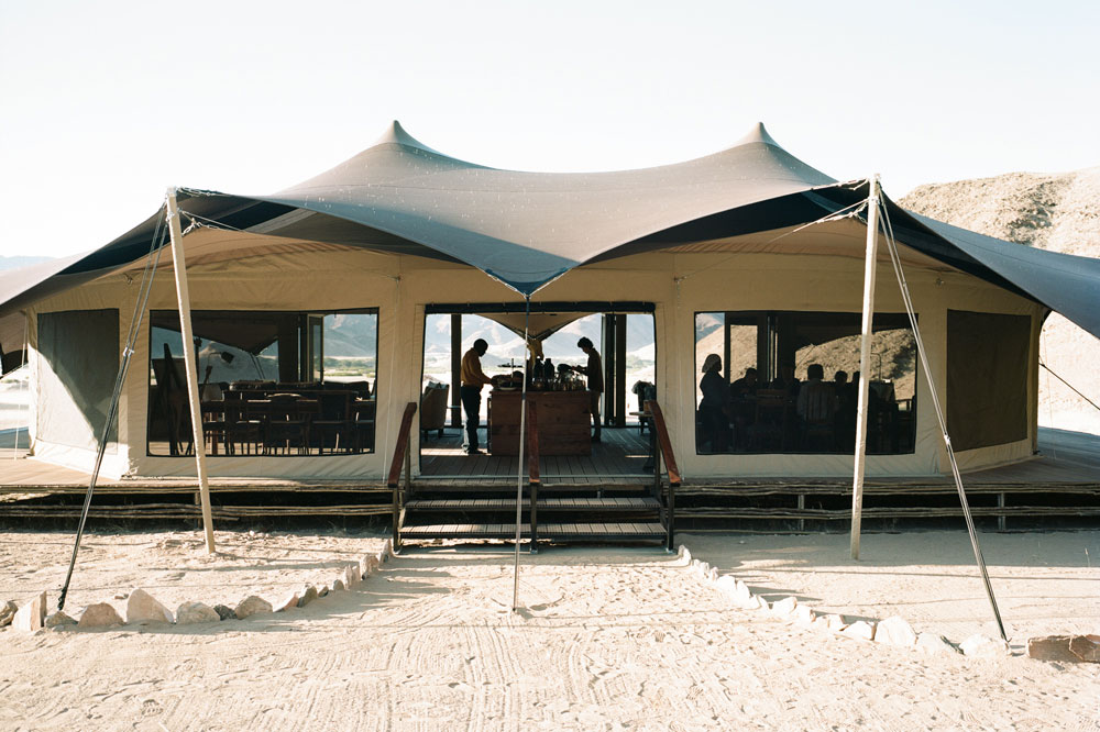 Exterior of Hoanib Valley Camp, luxury Namibia safari / Courtesy of Natural Selection Travel