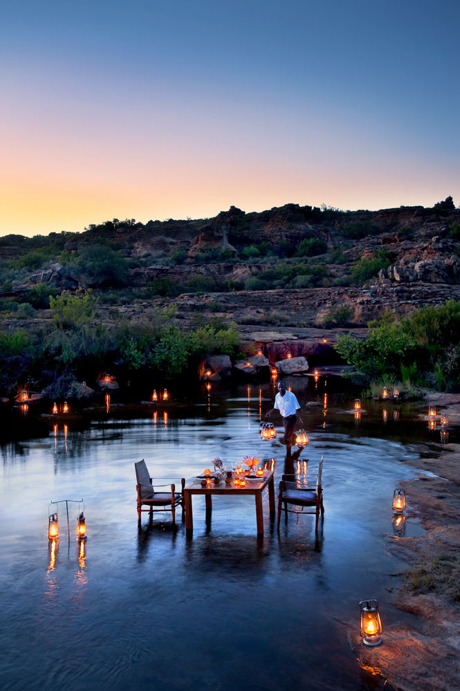Riverside dining at Bushmans Kloof Wilderness Reserve and Wellness Retreat / Courtesy of Red Carnation Hotels luxury South Africa safari