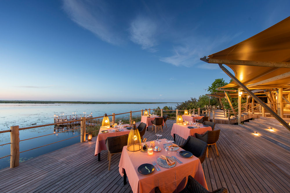 Dining deck at DumaTau / Courtesy of Wilderness Safaris luxury Botswana safari