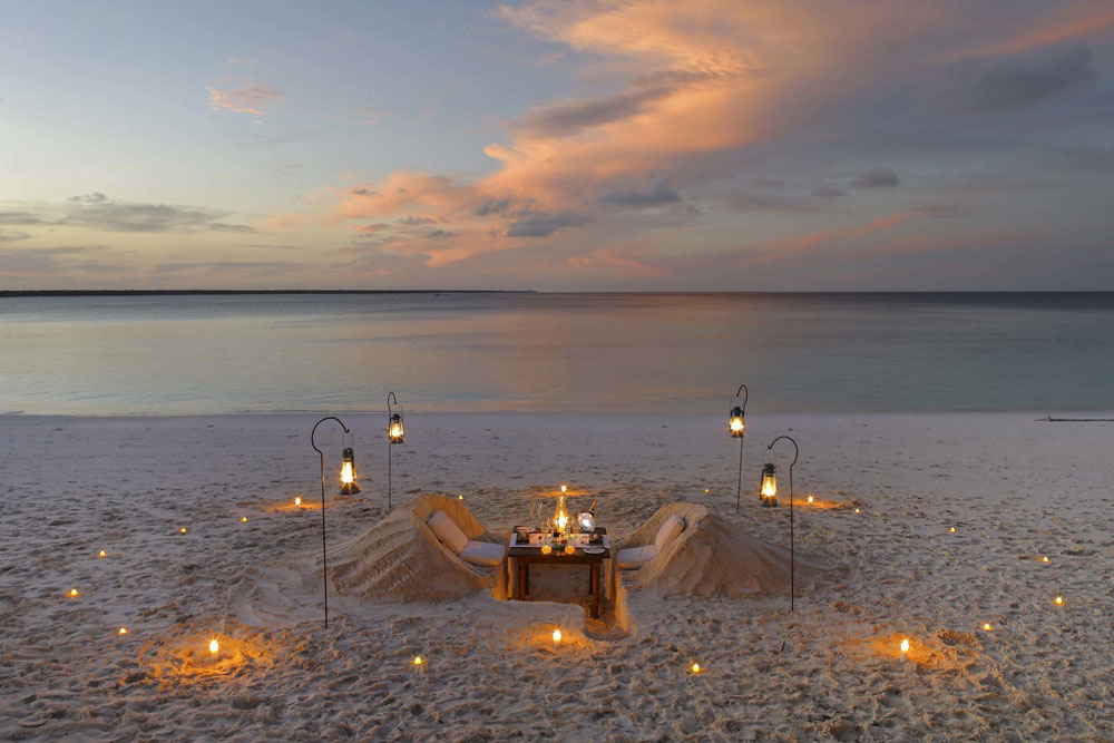 Dining at &Beyond Mnemba Island / Courtesy of &Beyond luxury Zanzibar beach resort